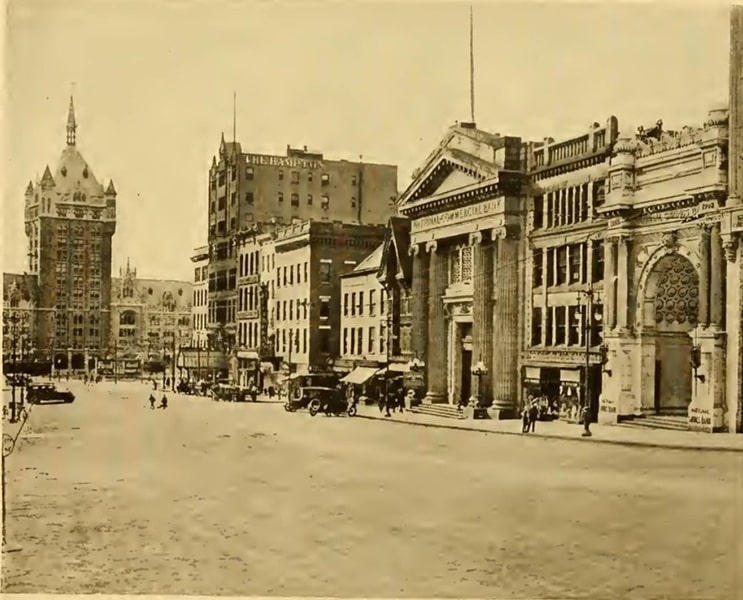 A sepia-toned photograph, street view of the front facade of the Commercial Bank of Albany.