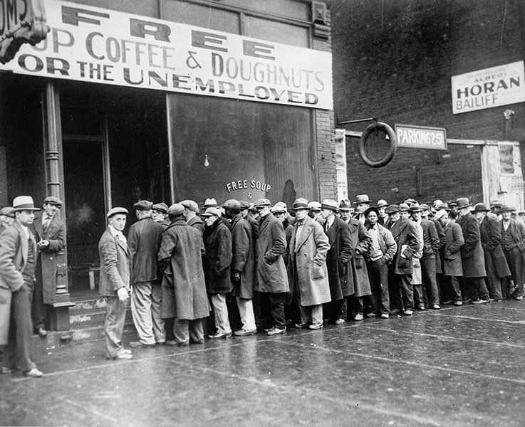 Unemployed men queued outside a depression soup kitchen.